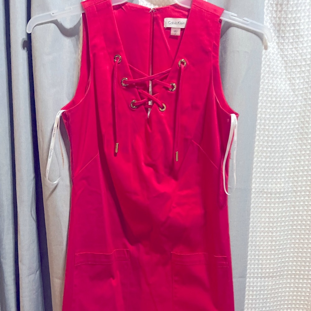 Great little hot pink dress with sassy tie ups front